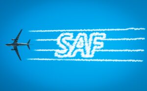  Commercial Aircraft flying in the air spelling SAF for Sustainable Aviation Fuel