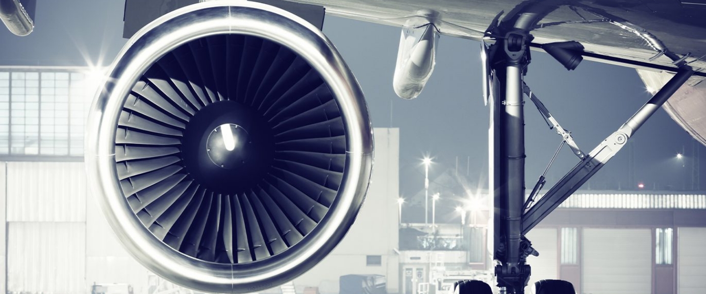 Aircraft engine at an airport tarmac for aviation leasing and asset management.